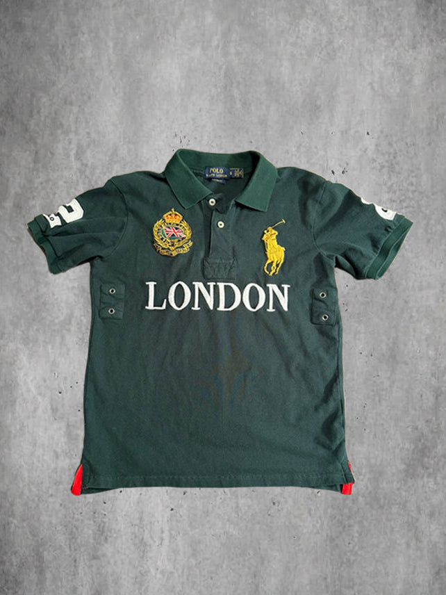 Green polo shirt with 'London' text and brand logo on a gray background