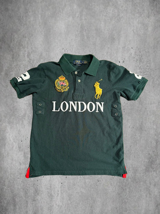 Green polo shirt with 'London' text and brand logo on a gray background