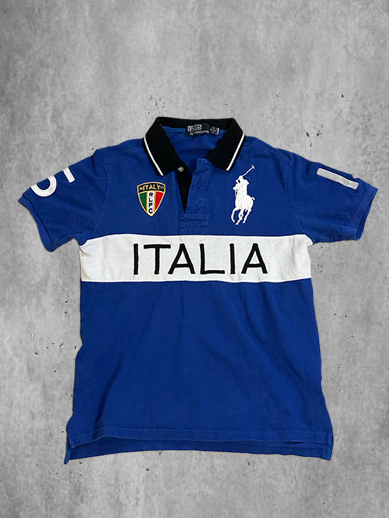 Blue and white polo shirt with 'ITALIA' text on a gray background
